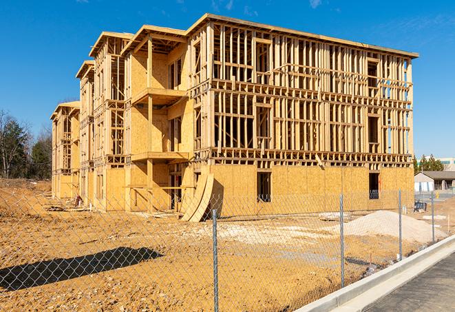 a job site enclosed by temporary chain link fences, ensuring safety for workers and pedestrians in Beech Grove, IN